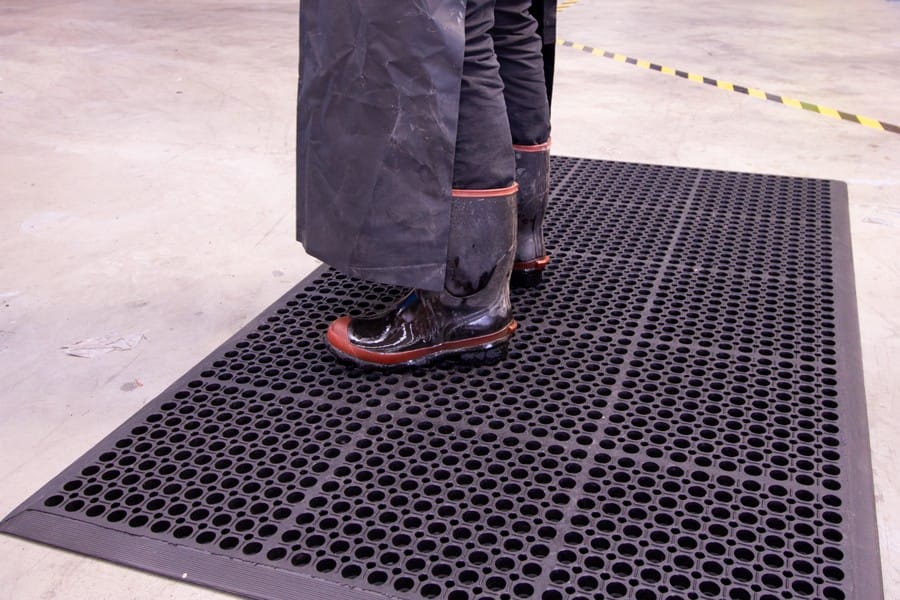 Person standing on SureFoot Anti-fatigue Mat